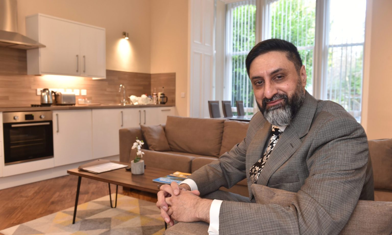 Amjed Rasul inside apartment suite